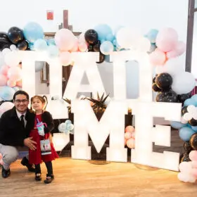 Dad and daughter with DAD & ME light-up letters