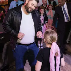 Dad and daughter dancing together